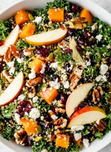 Colorful healthy fall salad with seasonal ingredients like apples, nuts, and greens