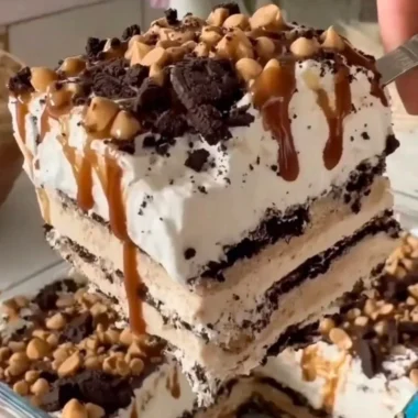 Delicious homemade ice cream cake layered with chocolate and vanilla ice cream.