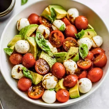 Light Avocado Caprese Salad with mozzarella, tomatoes, and basil