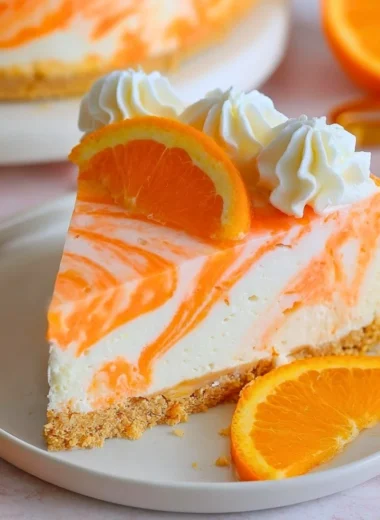 Delicious no-bake orange creamsicle cheesecake with a creamy texture and vibrant color