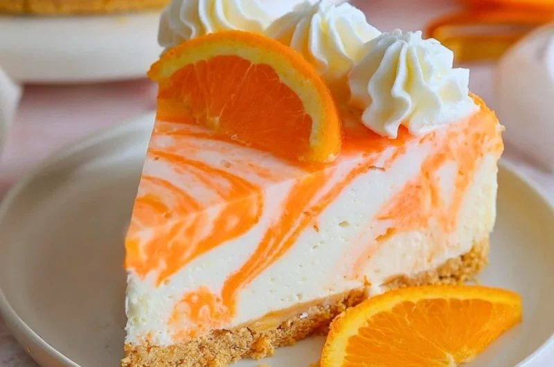 Delicious no-bake orange creamsicle cheesecake with a creamy texture and vibrant color