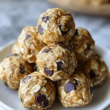 No-bake peanut butter energy bites arranged on a plate.