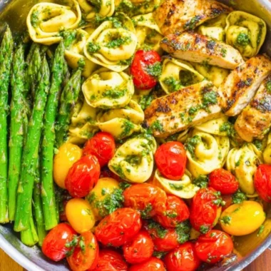 One-Pan Pesto Chicken with tortellini and colorful veggies