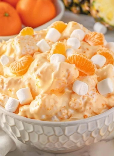 Delicious Orange Fluff Salad made with fluffy cream and fresh oranges