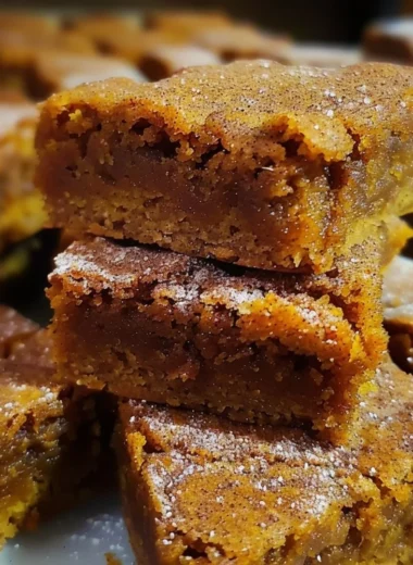 Delicious Pumpkin Snickerdoodle Blondies topped with cinnamon sugar