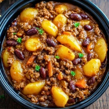 A delicious slow cooker cowboy casserole filled with beef, beans, and cheese