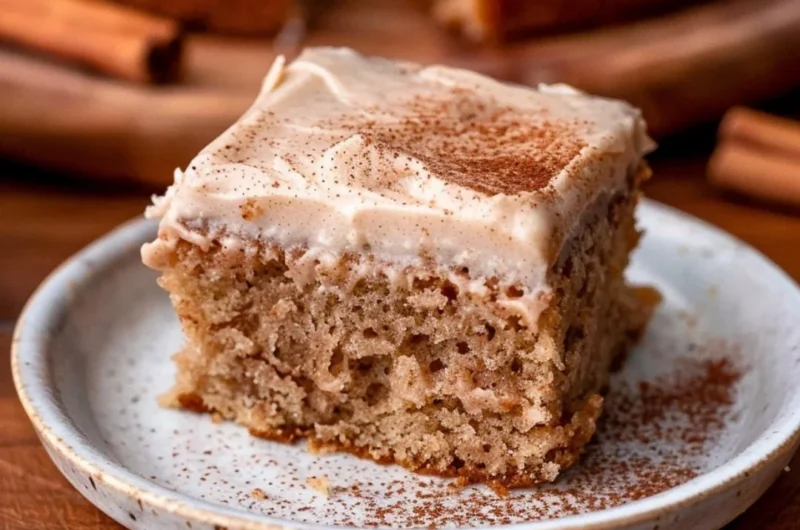 Delicious spiced chai cake topped with a sprinkle of cinnamon and served on a plate