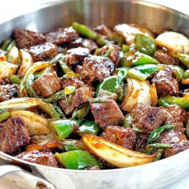 Delicious teriyaki steak bites featuring green pepper and onion.