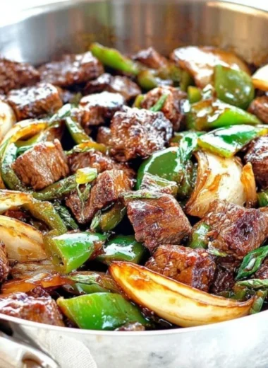 Delicious teriyaki steak bites featuring green pepper and onion.