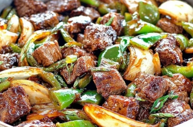 Delicious teriyaki steak bites featuring green pepper and onion.