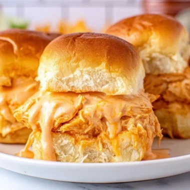 Buffalo Chicken Sliders served on a platter with fresh ingredients.