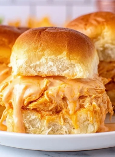Buffalo Chicken Sliders served on a platter with fresh ingredients.