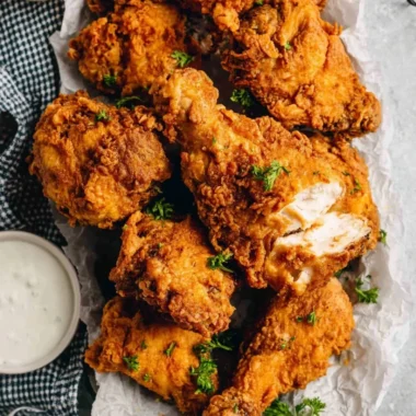 Plate of crispy buttermilk fried chicken served with sides