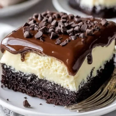 Delicious Chocolate Ooey Gooey Cake topped with chocolate drizzle