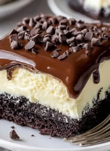 Delicious Chocolate Ooey Gooey Cake topped with chocolate drizzle