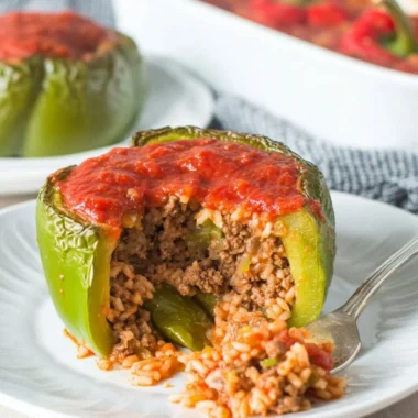 Delicious classic stuffed peppers filled with a savory mixture of rice and vegetables.