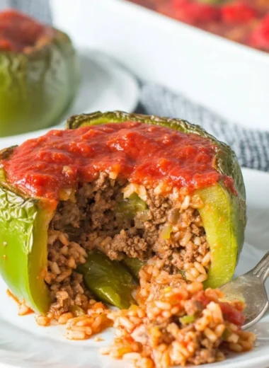 Delicious classic stuffed peppers filled with a savory mixture of rice and vegetables.