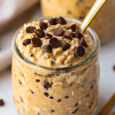 Delicious cookie dough overnight oats in a bowl topped with chocolate chips.