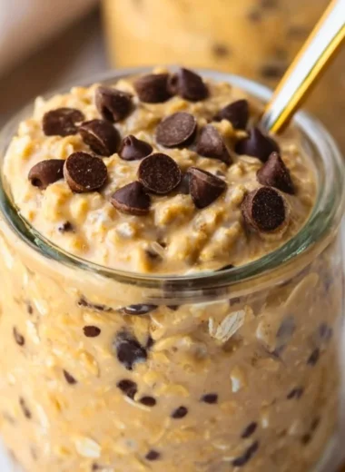 Delicious cookie dough overnight oats in a bowl topped with chocolate chips.