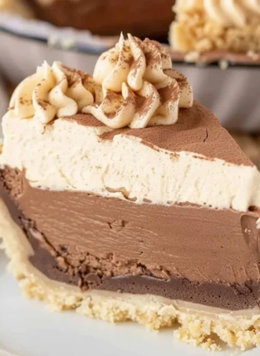 Costco peanut butter chocolate cream pie topped with chocolate drizzle