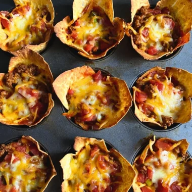 Delicious cozy taco muffins featuring seasoned meat and cheese