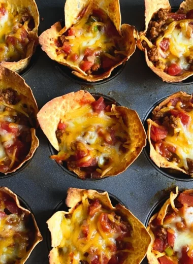 Delicious cozy taco muffins featuring seasoned meat and cheese