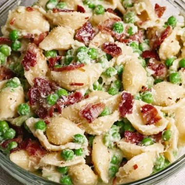 Creamy pea and bacon pasta salad served in a bowl