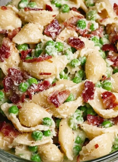Creamy pea and bacon pasta salad served in a bowl