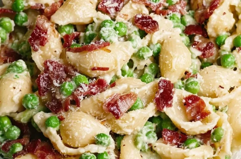 Creamy pea and bacon pasta salad served in a bowl