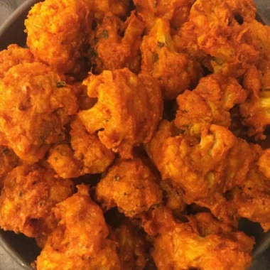 Crispy Baked Buffalo Cauliflower Wings on a plate with dipping sauce