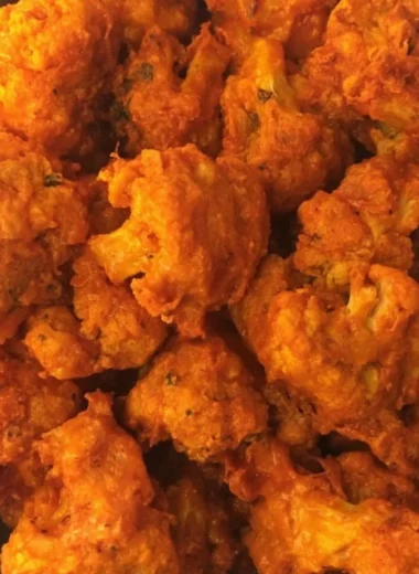 Crispy Baked Buffalo Cauliflower Wings on a plate with dipping sauce
