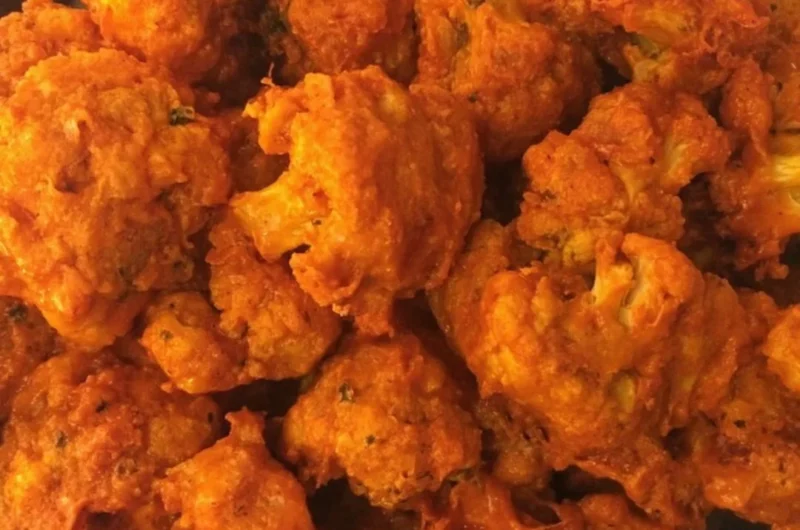 Crispy Baked Buffalo Cauliflower Wings on a plate with dipping sauce
