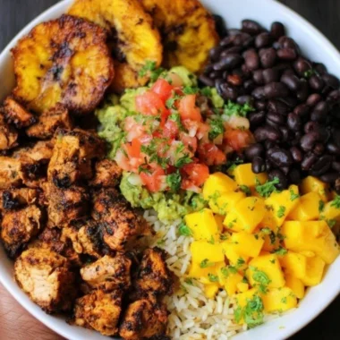 Cuban chicken served in a Black Bean Rice Bowl with vibrant toppings