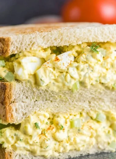 Creamy egg salad served in a bowl with spices and herbs