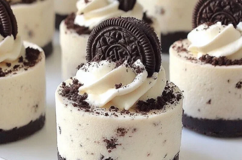 Delicious no-bake Oreo cheesecakes topped with Oreo cookie crumbles