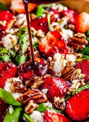 Fresh Spinach Strawberry Salad topped with Pecans