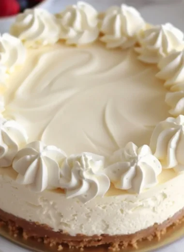 Delicious homemade vanilla cheesecake served on a white plate