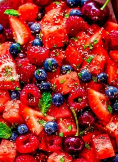 Colorful bowl of Watermelon Salad with feta cheese and mint leaves