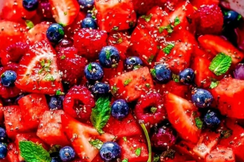 Colorful bowl of Watermelon Salad with feta cheese and mint leaves